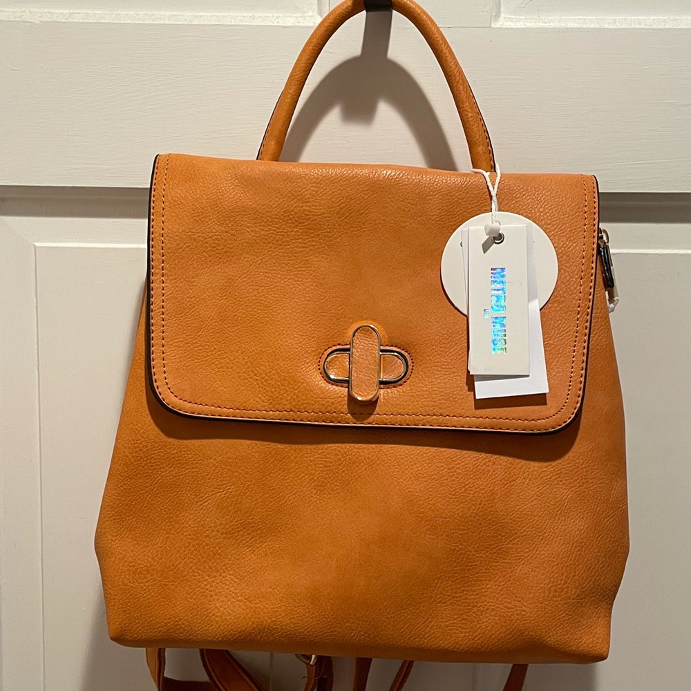 Tan convertible backpack.  Never been used